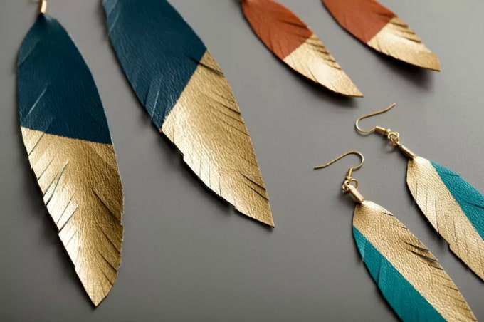 gold feather earrings
